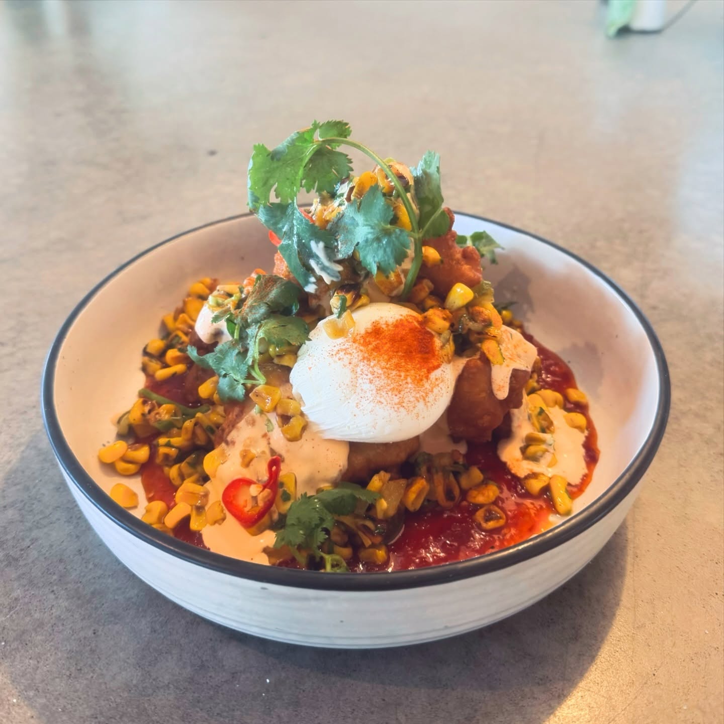 Corn fritters with poached egg