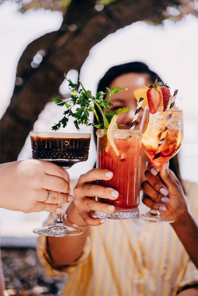 Friends cheersing cocktails